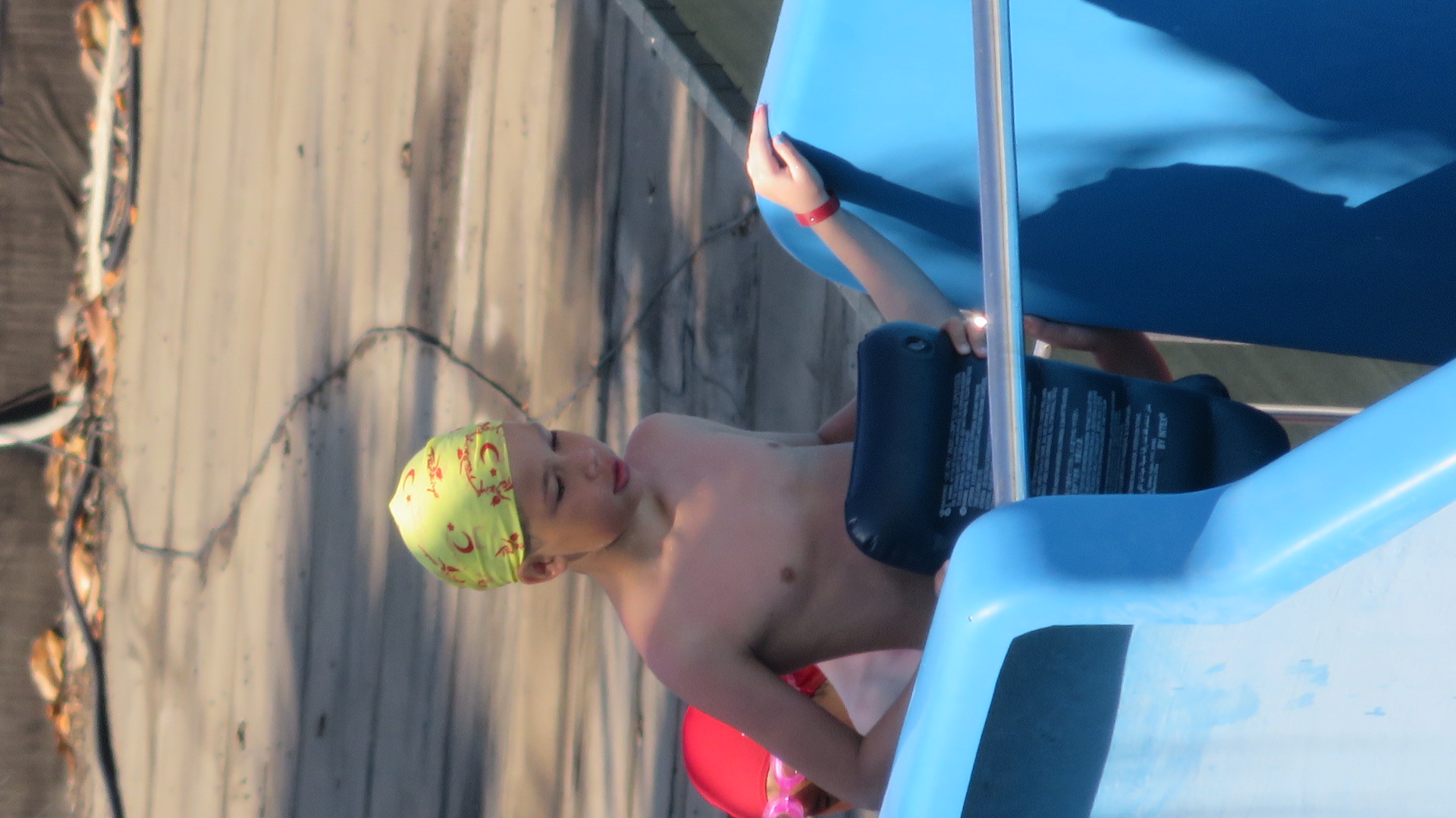 Boy in white cap and yellow shir